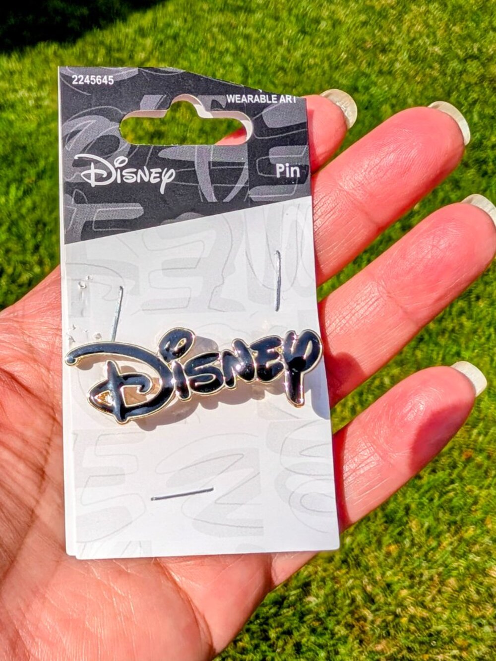 Disney Black and Gold Enamel Logo Pin - NWT
